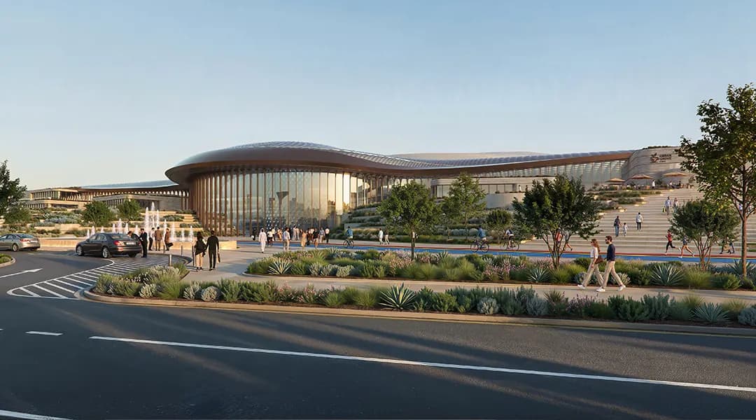 Arena and retail destination in the Wadeem district, with landscaped plazas and tree-lined walkways