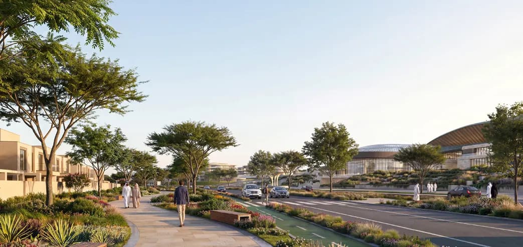 Landscaped boulevard with pedestrians and traffic leading to the arena at Wadeem